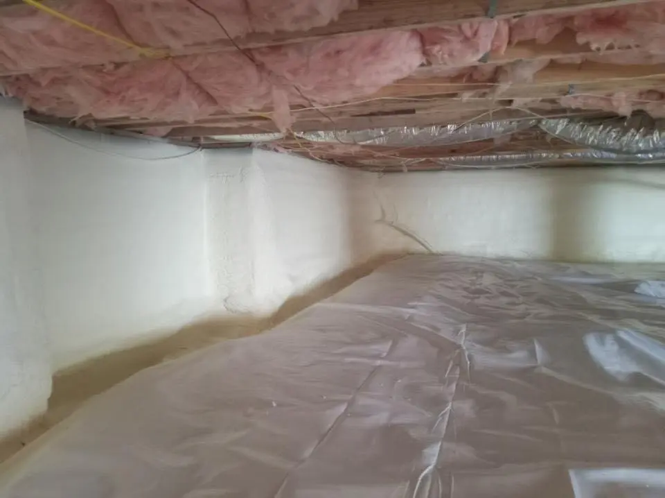 Crawl space encapsulation with closed-cell spray foam for Commercial Roof Restoration in Moreau